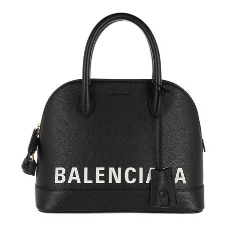 white balenciaga bag with black writing